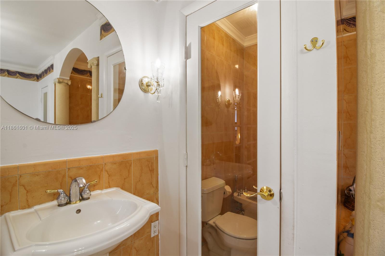 6101 Southwest 13th Terrace West Miami, FL 33144 - Photo 32 of 47 a bathroom with a sink and mirror