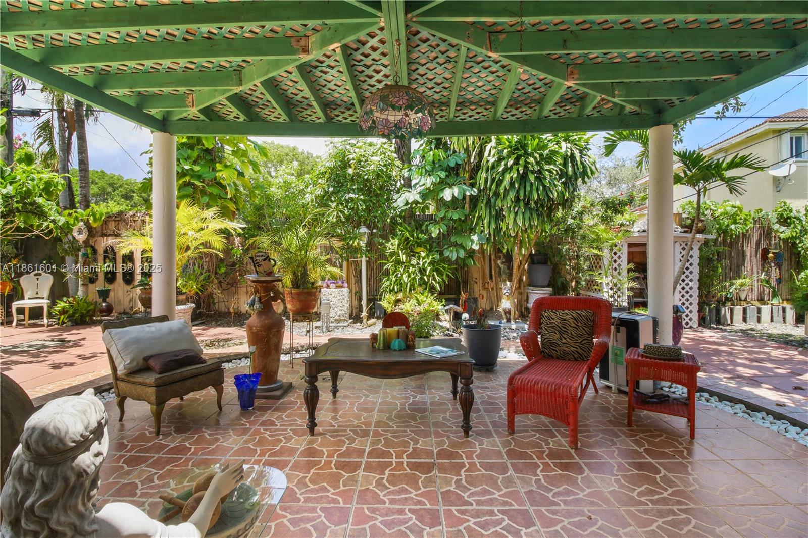6101 Southwest 13th Terrace West Miami, FL 33144 - Photo 33 of 47 a outdoor living space with furniture and garden view