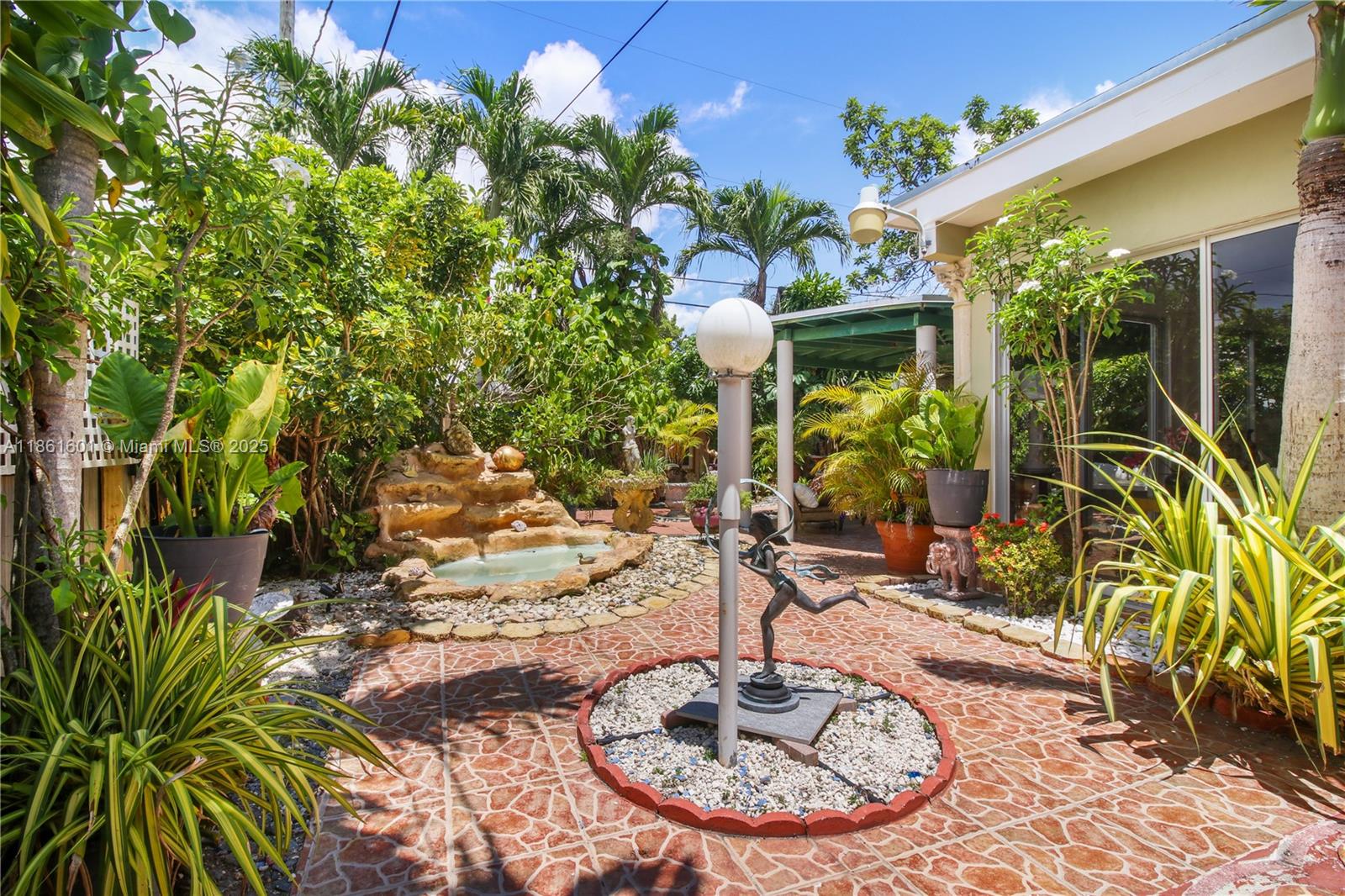 6101 Southwest 13th Terrace West Miami, FL 33144 - Photo 39 of 47 a vase of flowers sitting on a table