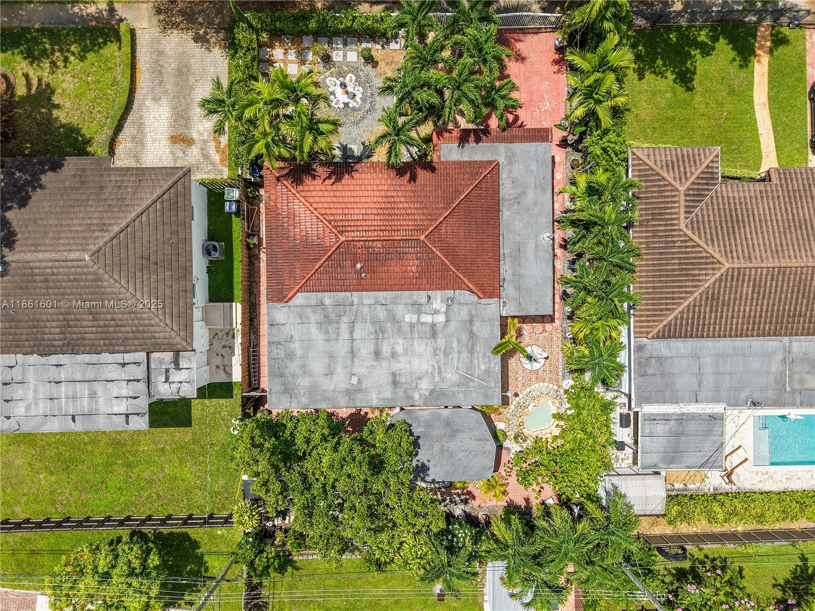 6101 Southwest 13th Terrace West Miami, FL 33144 - Photo 41 of 47 an aerial view of a house with a yard and a fountain