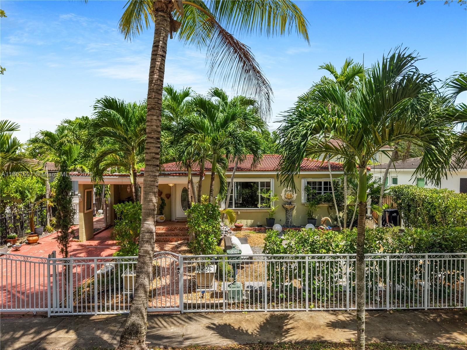6101 Southwest 13th Terrace West Miami, FL 33144 - Photo 45 of 47 front view of a house with a garden