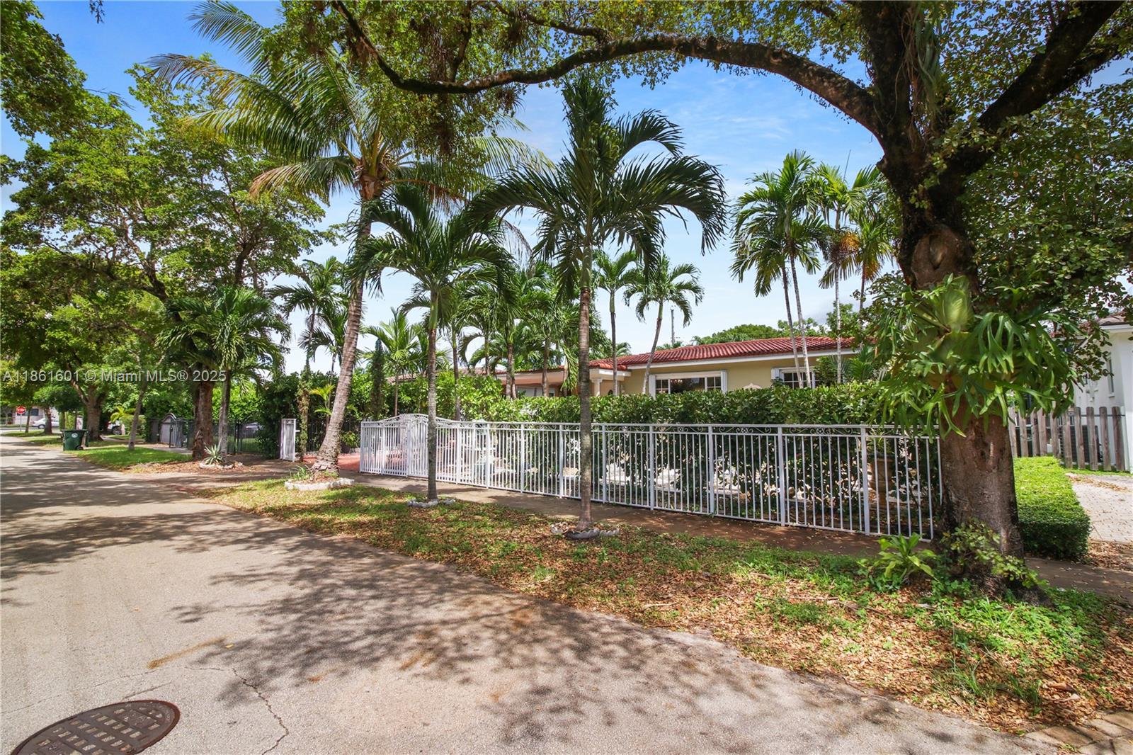 6101 Southwest 13th Terrace West Miami, FL 33144 - Photo 46 of 47 a view of a swimming pool with a patio and a yard