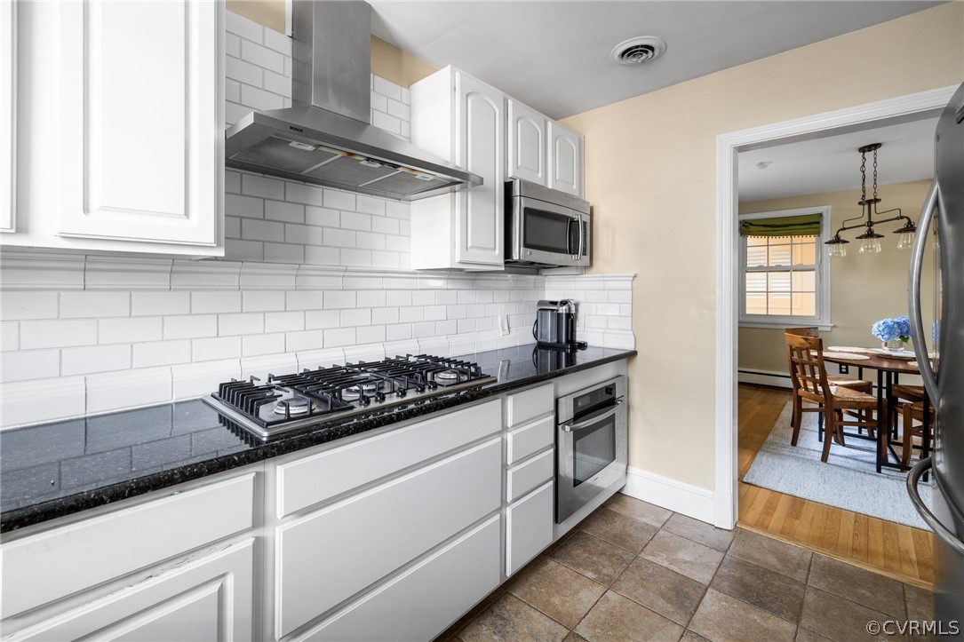 1003 Bevridge Road Richmond, VA 23226 - Photo 12 of 29 a kitchen with stainless steel appliances granite countertop a sink a stove and cabinets