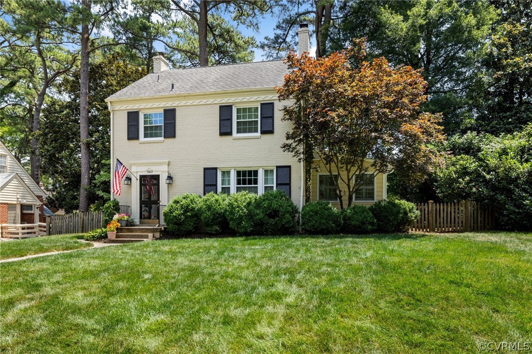 1003 Bevridge Road Richmond, VA 23226 - Photo 2 of 29 a view of a white house next to a yard and large trees