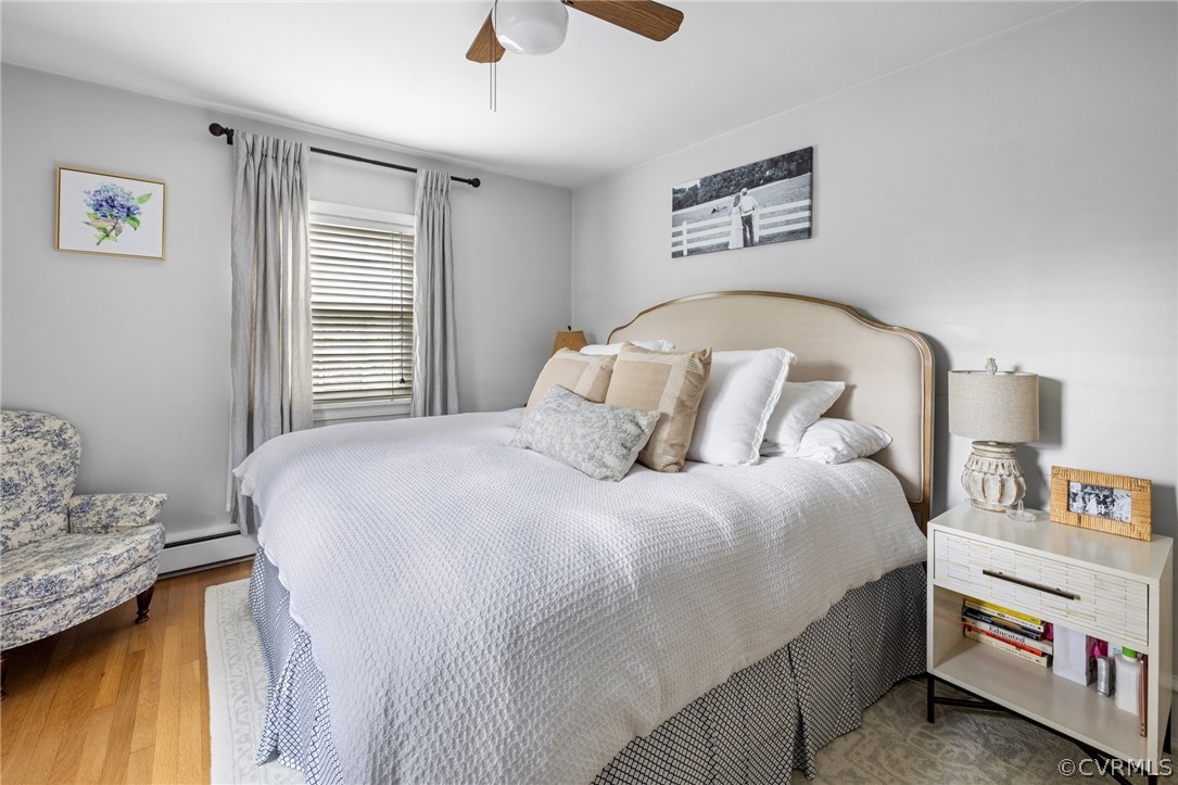 1003 Bevridge Road Richmond, VA 23226 - Photo 22 of 29 a bedroom with a bed and a chandelier