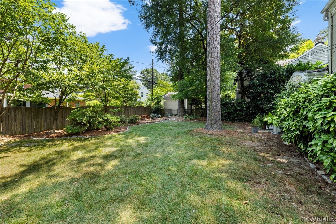 1003 Bevridge Road Richmond, VA 23226 - Photo 25 of 29 a view of a yard with plants and large trees