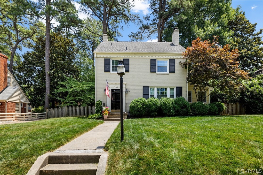 1003 Bevridge Road Richmond, VA 23226 - Photo 3 of 29 a view of a white house next to a yard and potted plants