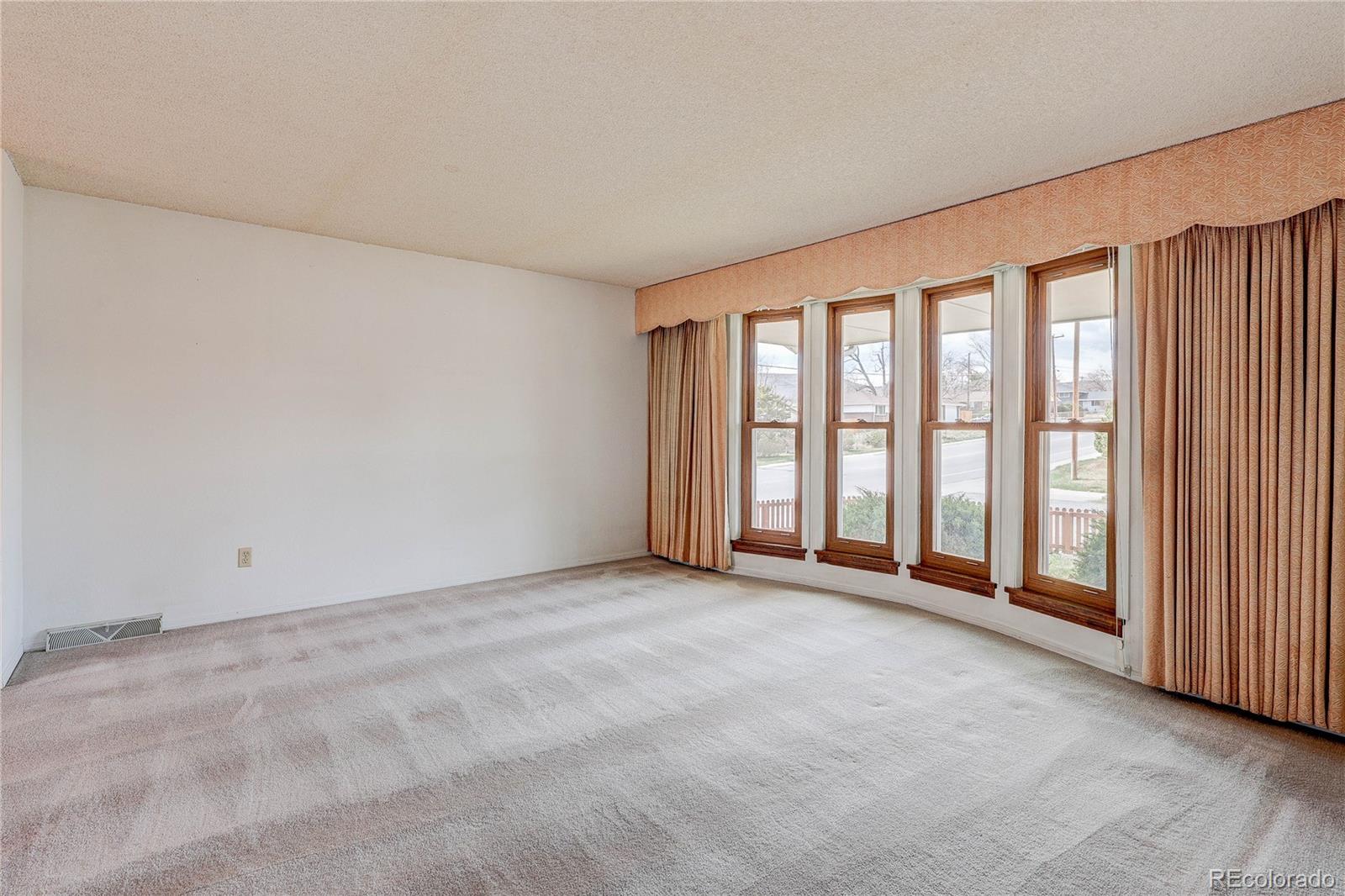 806 Cole Street Golden, CO 80401 - Photo 16 of 36 an empty room with windows