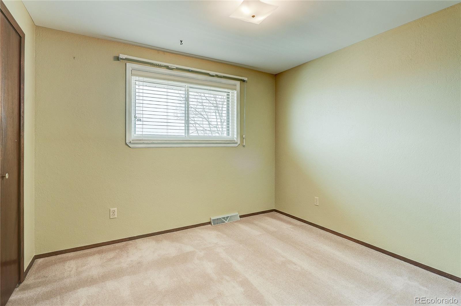 806 Cole Street Golden, CO 80401 - Photo 22 of 36 an empty room with a window