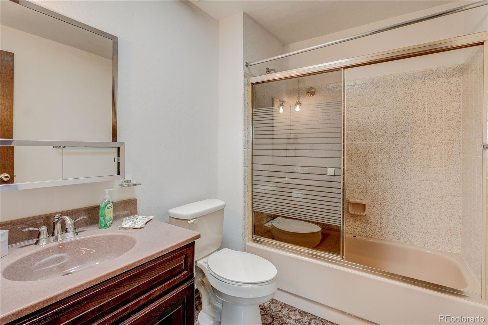 806 Cole Street Golden, CO 80401 - Photo 23 of 36 a bathroom with a sink a toilet and shower