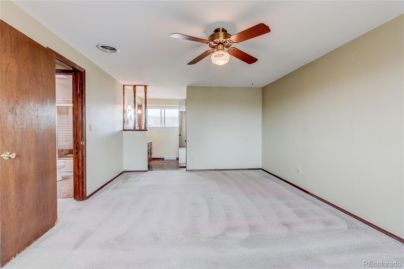 806 Cole Street Golden, CO 80401 - Photo 25 of 36 an empty room with closet and windows