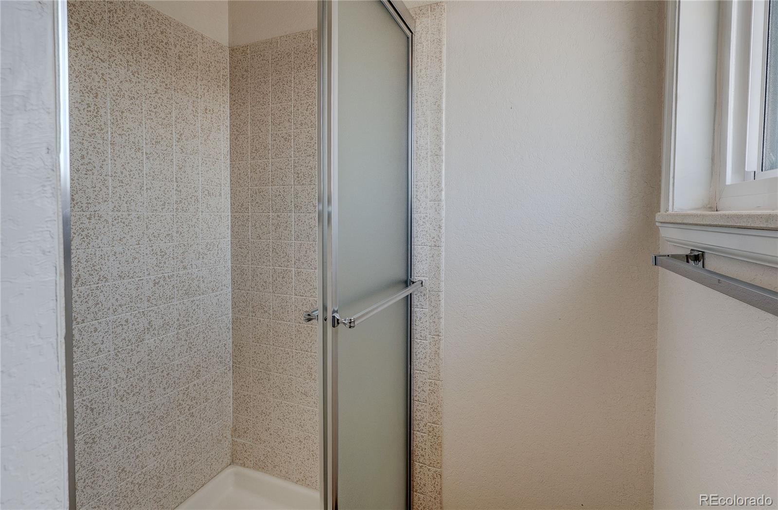 806 Cole Street Golden, CO 80401 - Photo 26 of 36 a bathroom with a shower