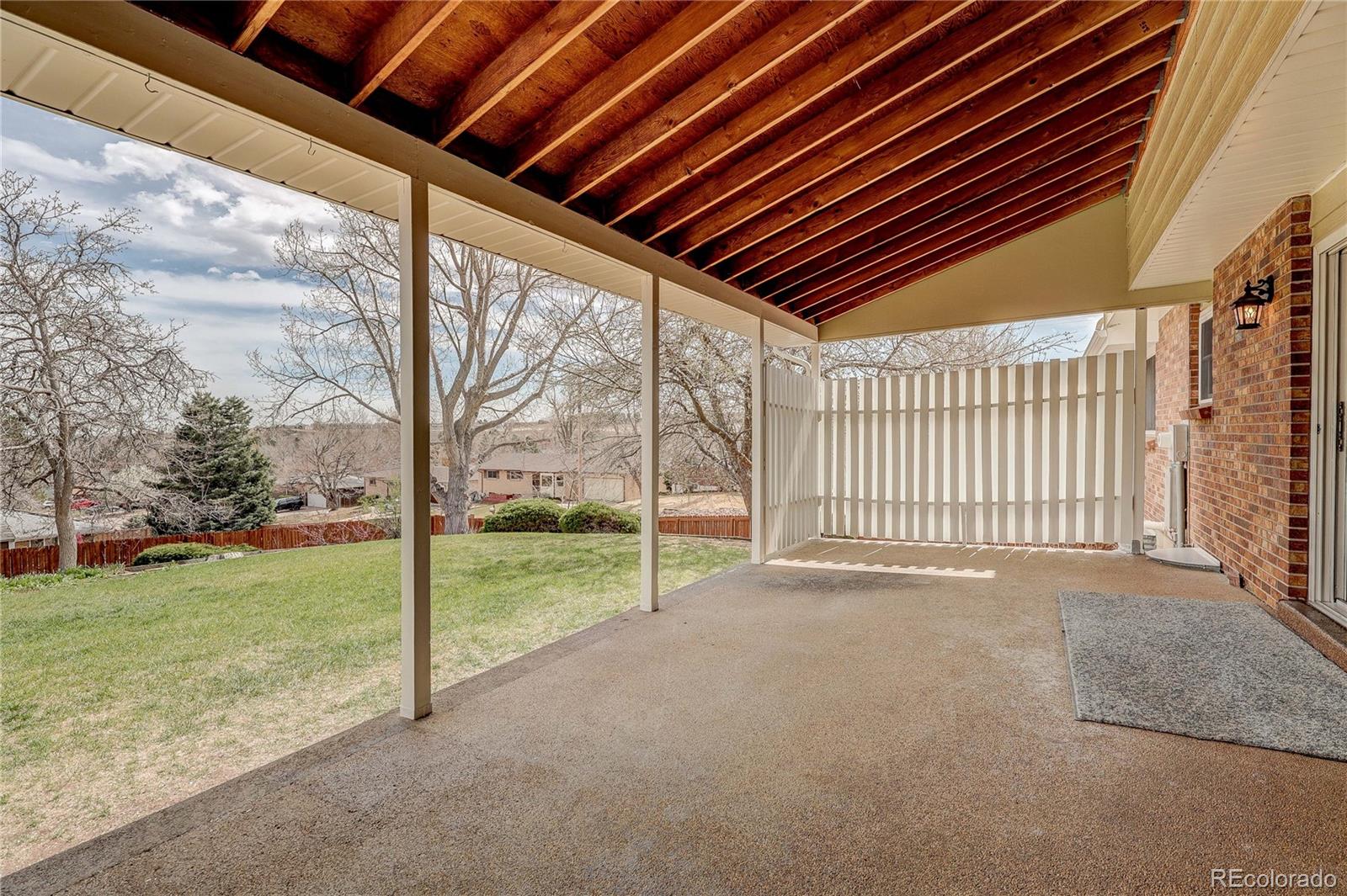806 Cole Street Golden, CO 80401 - Photo 27 of 36 a view of an empty room with yard and tree s