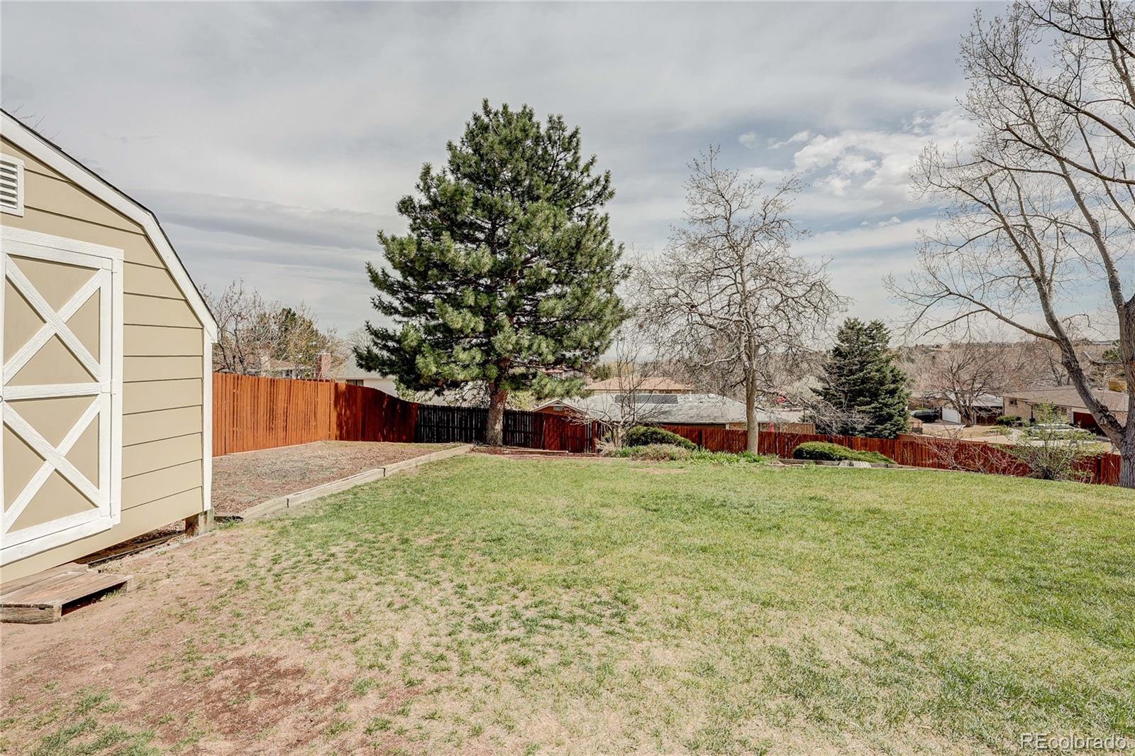 806 Cole Street Golden, CO 80401 - Photo 28 of 36 a view of a backyard with large trees