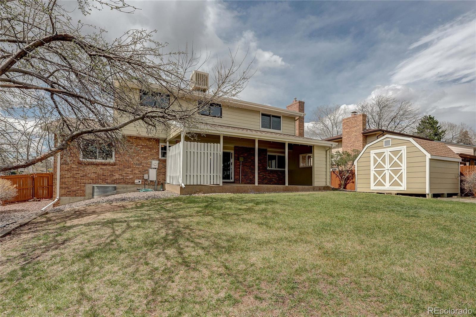 806 Cole Street Golden, CO 80401 - Photo 30 of 36 a front view of a house with a garden