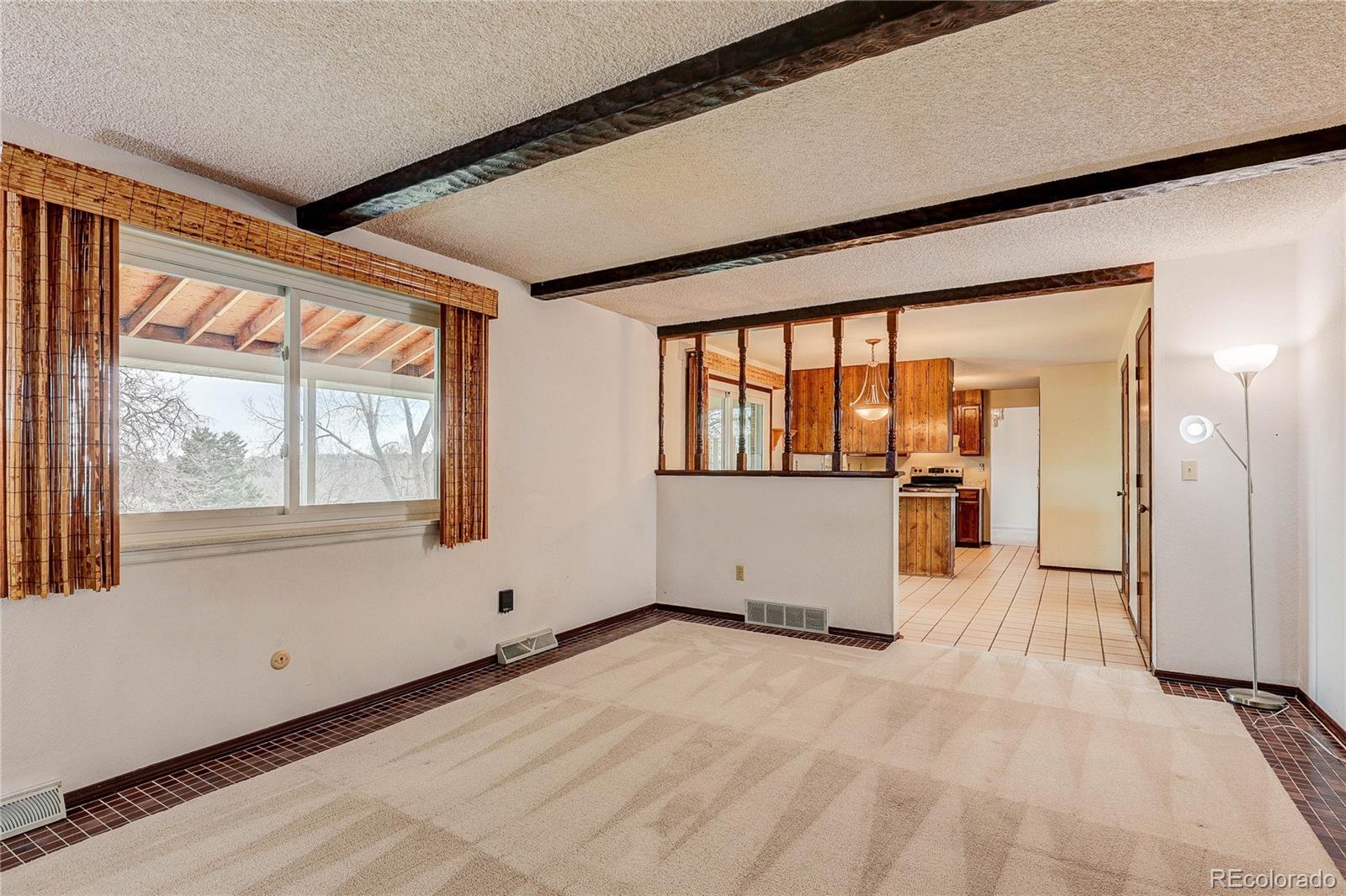 806 Cole Street Golden, CO 80401 - Photo 3 of 36 a view of empty room with wooden floor and windows