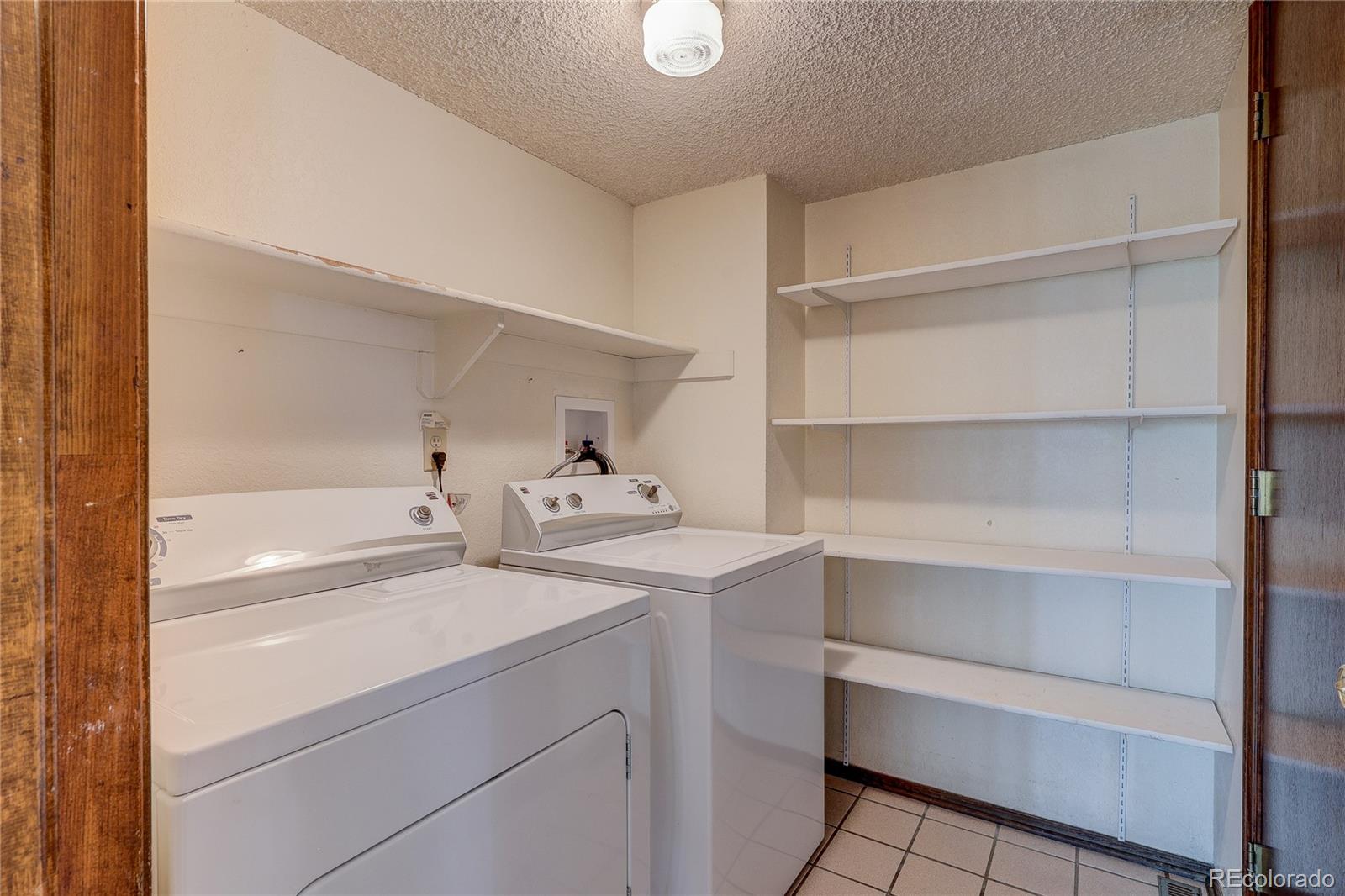 806 Cole Street Golden, CO 80401 - Photo 31 of 36 a view of walk in closet with empty racks