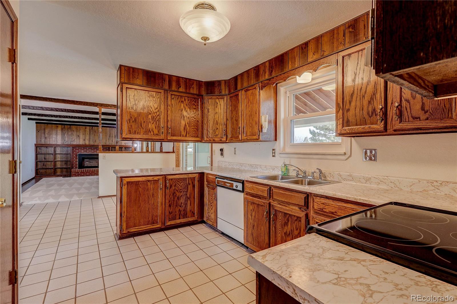 806 Cole Street Golden, CO 80401 - Photo 10 of 36 a kitchen that has a sink and a stove in it