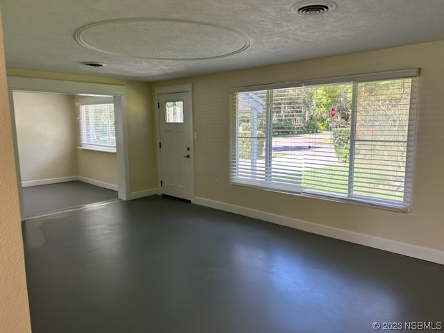 795 Biro Drive Port Orange, FL 32129 - Photo 14 of 26 a view of an empty room with a window and wooden floor