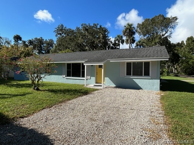 795 Biro Drive Port Orange, FL 32129 - Photo 4 of 26 a front view of a house with a garden and yard