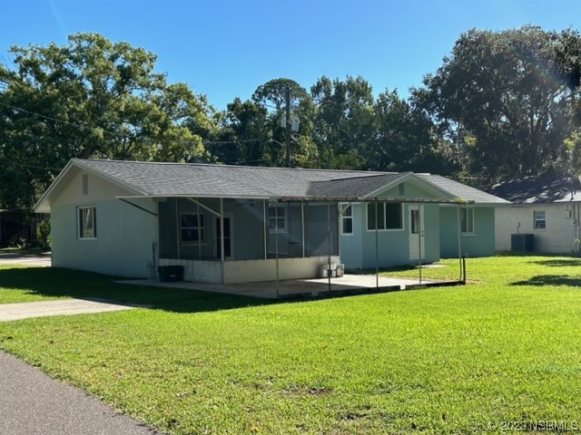 795 Biro Drive Port Orange, FL 32129 - Photo 5 of 26 a front view of a house with a yard and trees