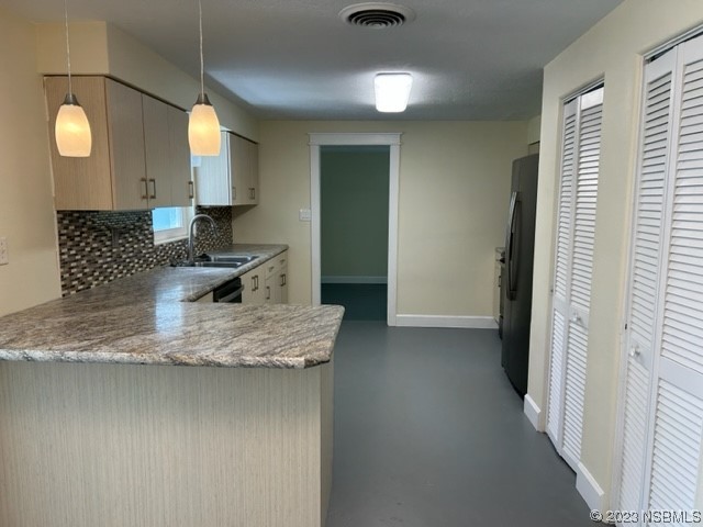 795 Biro Drive Port Orange, FL 32129 - Photo 8 of 26 a kitchen with kitchen island granite countertop a sink a counter top space and cabinets