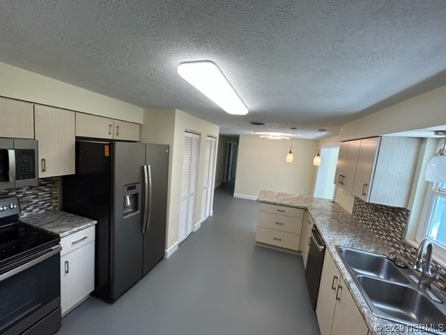 795 Biro Drive Port Orange, FL 32129 - Photo 9 of 26 a kitchen with a sink stove and refrigerator