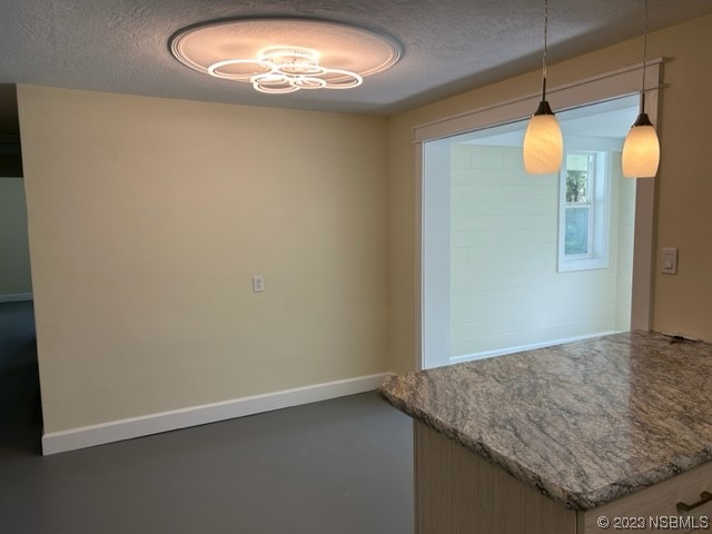 795 Biro Drive Port Orange, FL 32129 - Photo 10 of 26 an empty room with wooden floor and windows