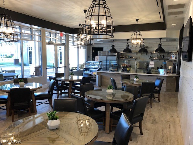 498 Pebble Run Avenue Henderson, NV 89011 - Photo 38 of 47 This communal dining area showcases ample seating, abundant natural light, and a functional serving counter.