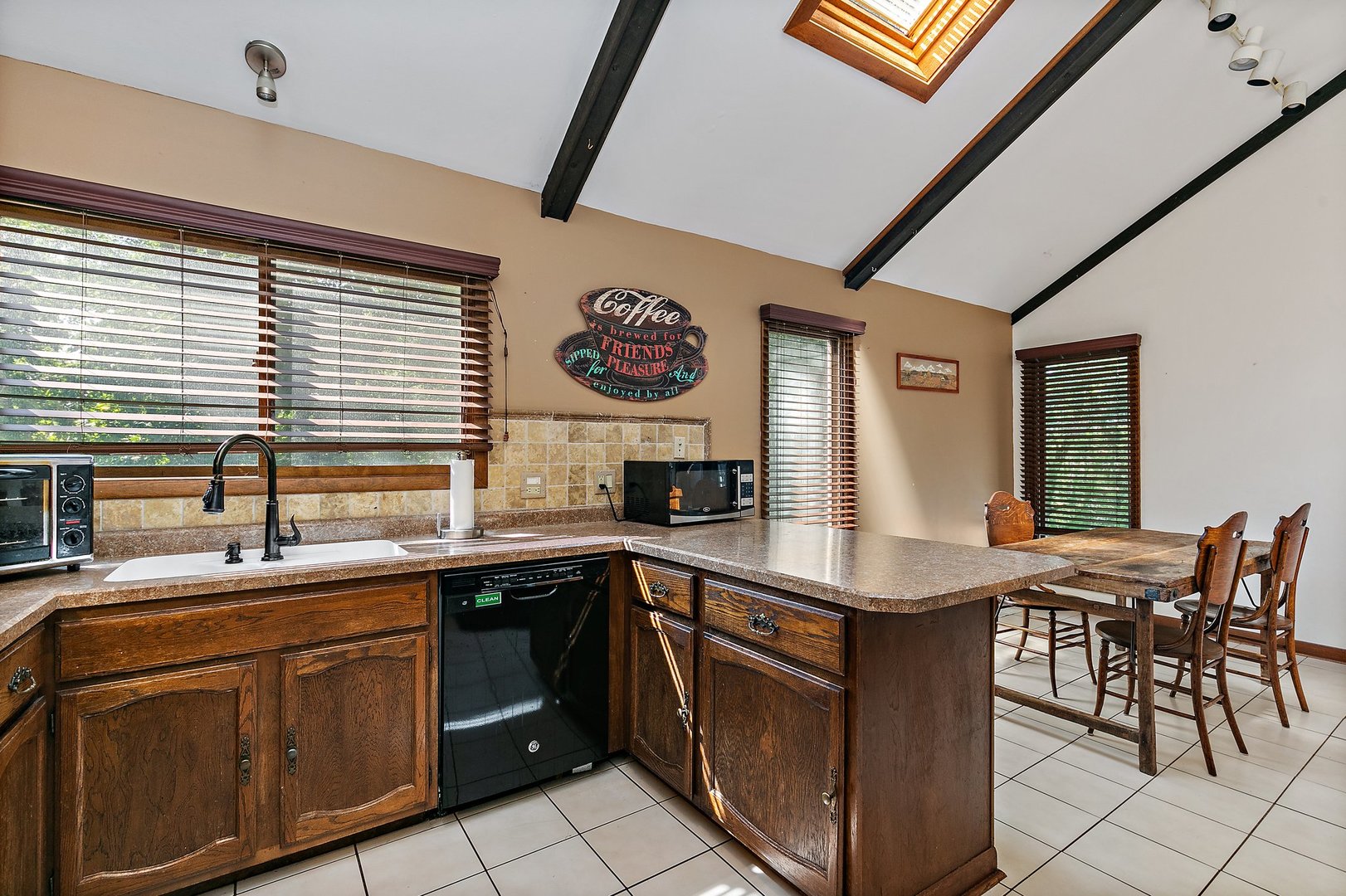 5305 North Ridgeway Road Ringwood, IL 60072 - Photo 11 of 27 a kitchen with a sink and cabinets
