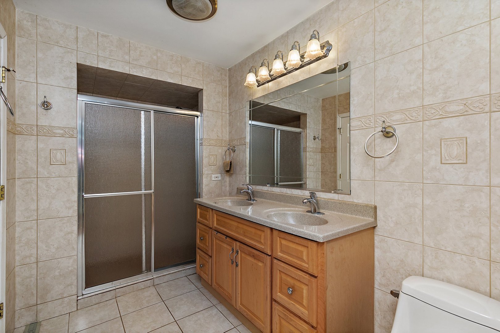 5305 North Ridgeway Road Ringwood, IL 60072 - Photo 12 of 27 a bathroom with a granite countertop sink and a mirror