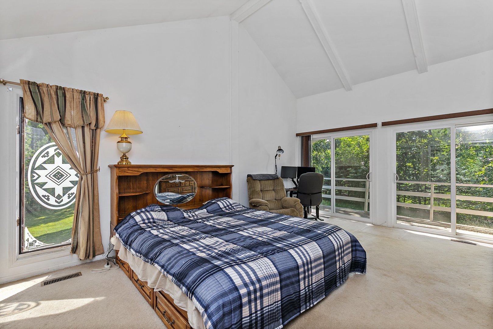 5305 North Ridgeway Road Ringwood, IL 60072 - Photo 13 of 27 a bedroom with a bed a table and a large window