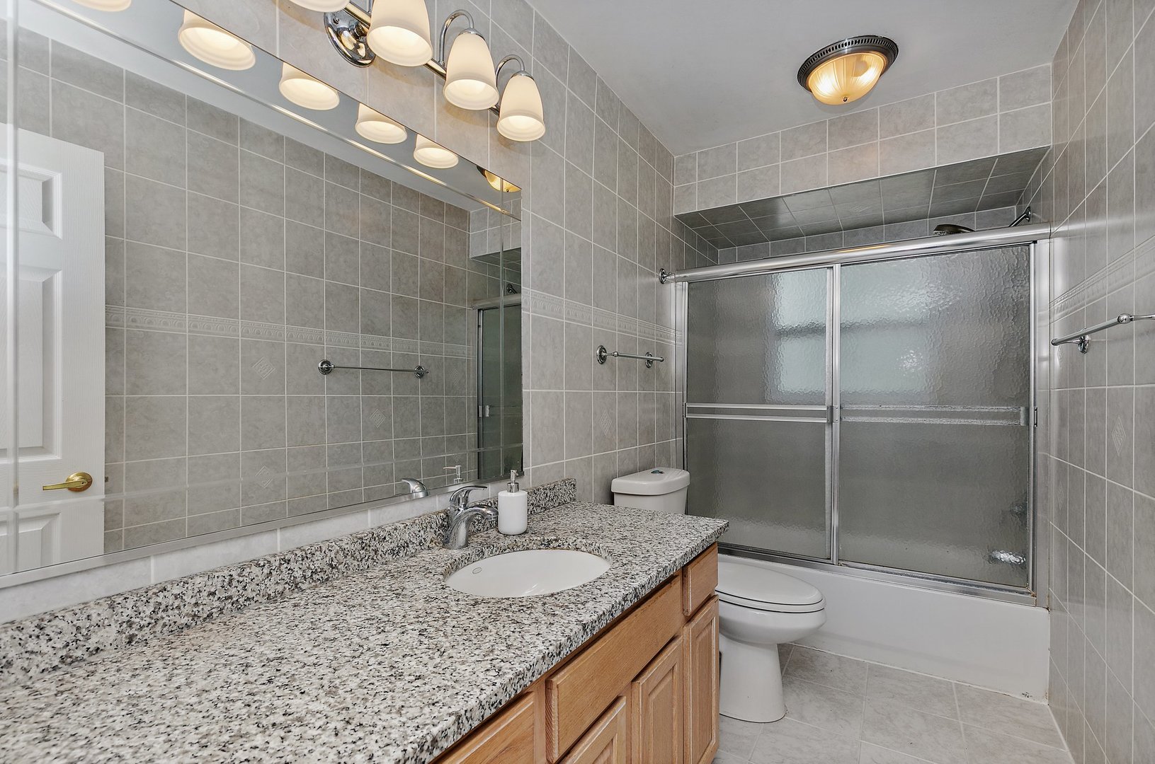 5305 North Ridgeway Road Ringwood, IL 60072 - Photo 17 of 27 a bathroom with a granite countertop sink toilet and shower