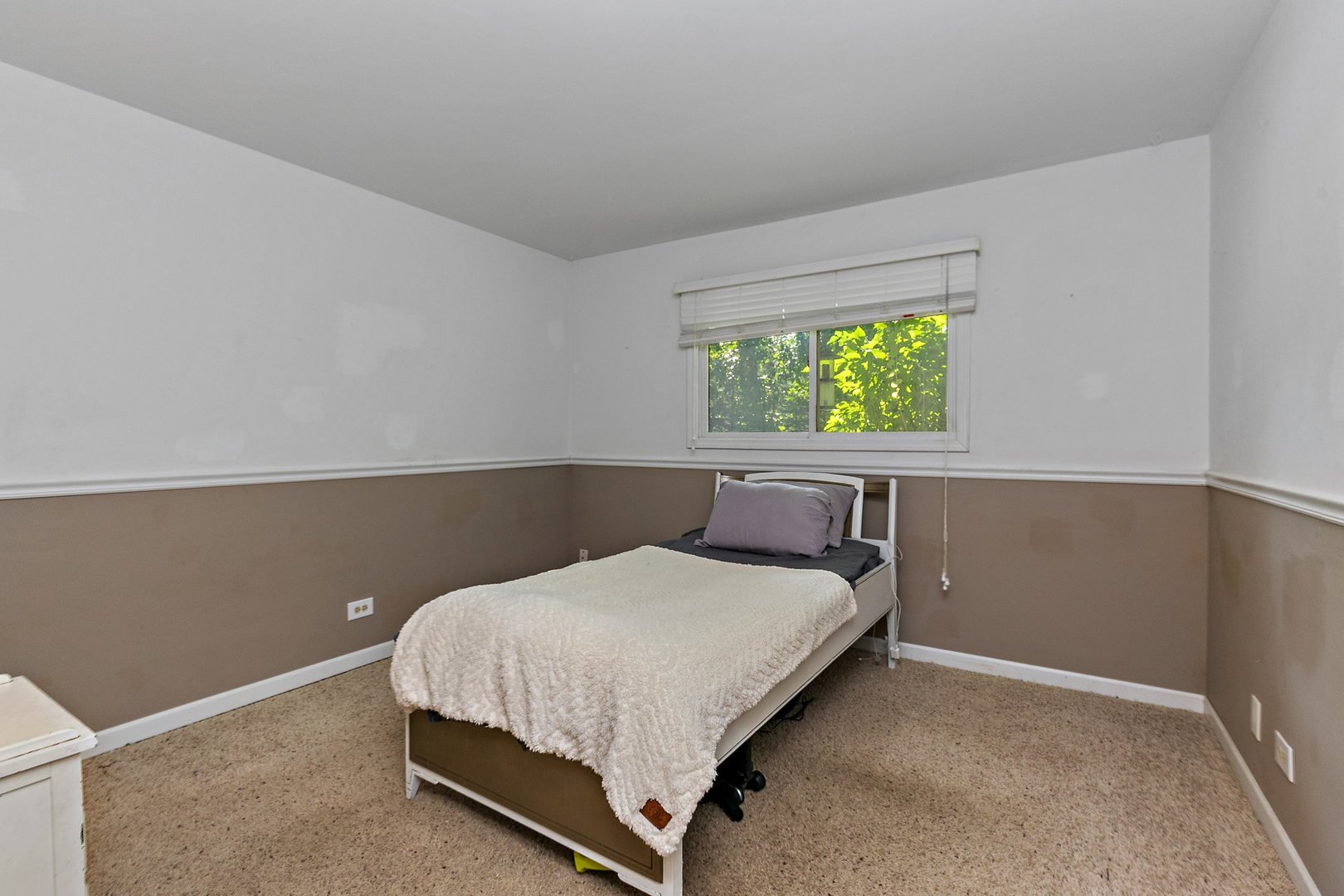 5305 North Ridgeway Road Ringwood, IL 60072 - Photo 19 of 27 a bed sitting in a bedroom next to a window