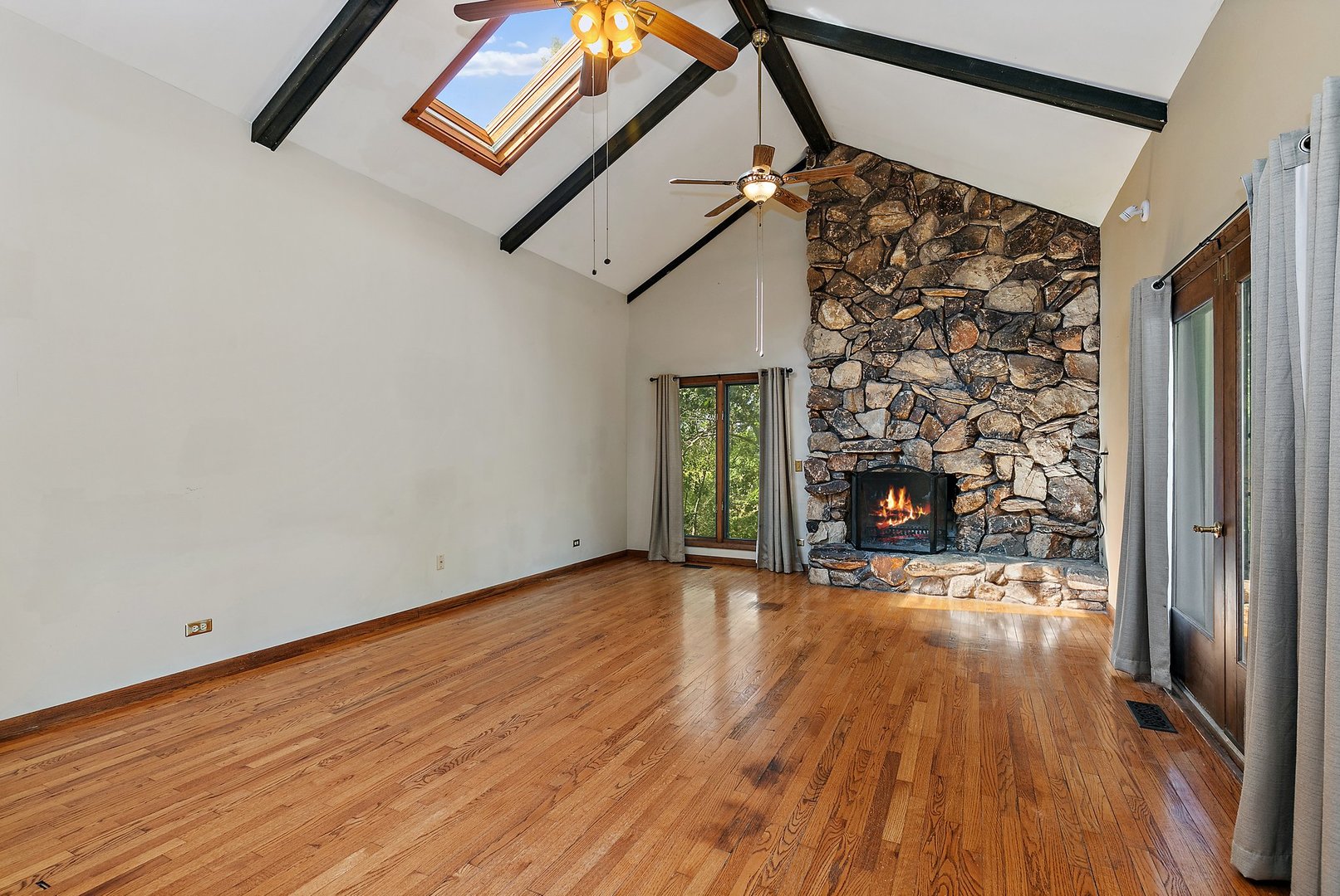 5305 North Ridgeway Road Ringwood, IL 60072 - Photo 6 of 27 a view of an empty room with wooden floor and a window