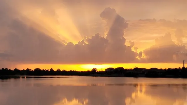 a large kitchen with stainless steel appliances granite countertop a lot of counter space