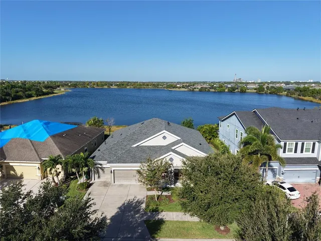 a kitchen with stainless steel appliances sink stove top oven and cabinets