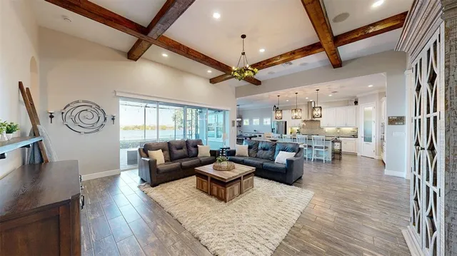 an aerial view of a house with a yard swimming pool and outdoor seating
