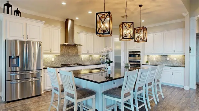 an aerial view of a house with a lake view