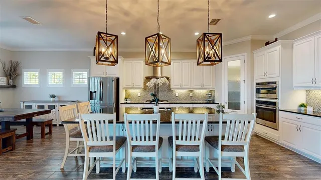 an aerial view of a house with yard swimming pool and outdoor seating