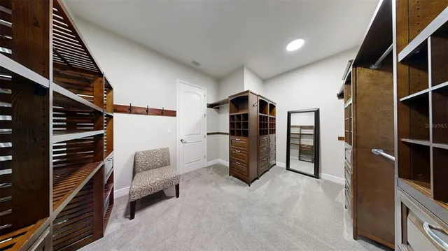 an aerial view of a house with garden space and lake view