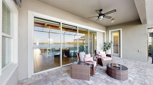 an aerial view of a house with a garden and lake view