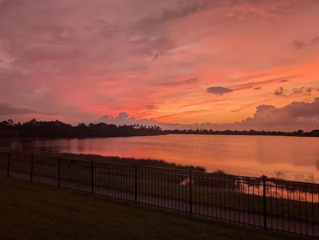 an aerial view of a house with a swimming pool