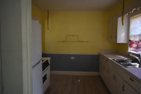 a kitchen with a sink and cabinets