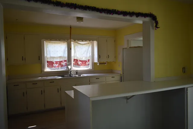 a kitchen with a sink and a window