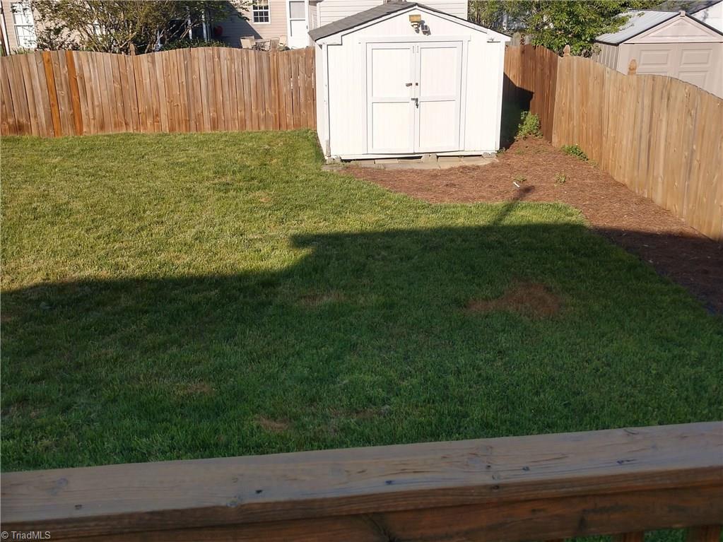 1773 Spring Path Trail Clemmons, NC 27012 - Photo 19 of 20 FENCED IN BACKYARD AND UTILITY BUILDING, THIS AREA VERY NICELY MAINTAINED GREAT FOR CHILDREN OR PETS.