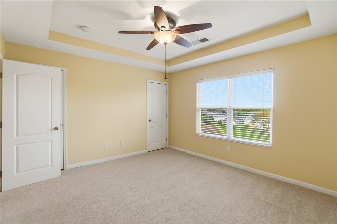 4324 Straight Arrow Road Dayton, OH 45430 - Photo 25 of 40 This spacious bedroom offers carpeted flooring and ample natural light through a large window.
