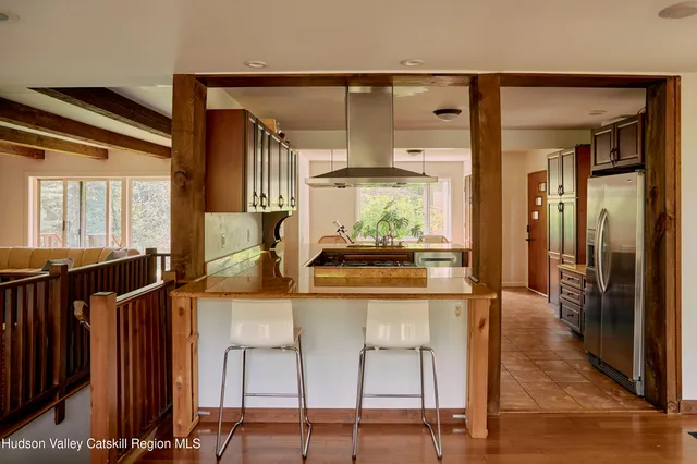 a kitchen with stainless steel appliances granite countertop a stove and a refrigerator