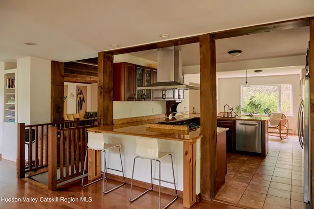 a kitchen with stainless steel appliances granite countertop a stove and a sink