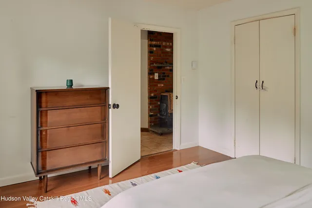 a bathroom with a sink toilet a mirror and shower